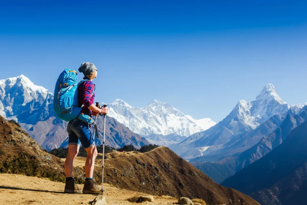 Nepal trekking trail teahouse with mountain views and local guide